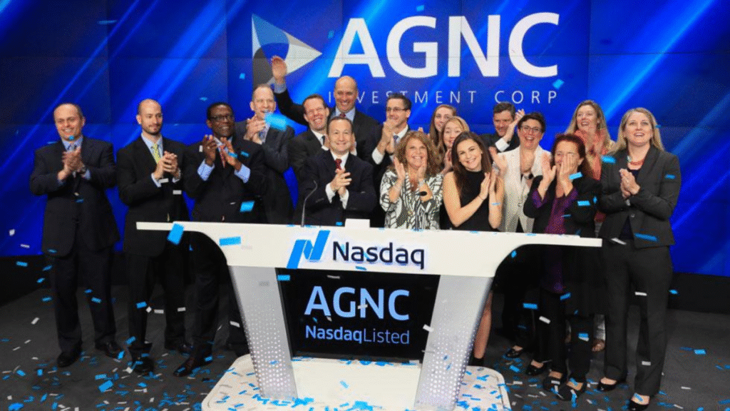 AGNC Investment Corp executives ringing the Nasdaq opening bell during a celebration ceremony, surrounded by smiling team members and confetti